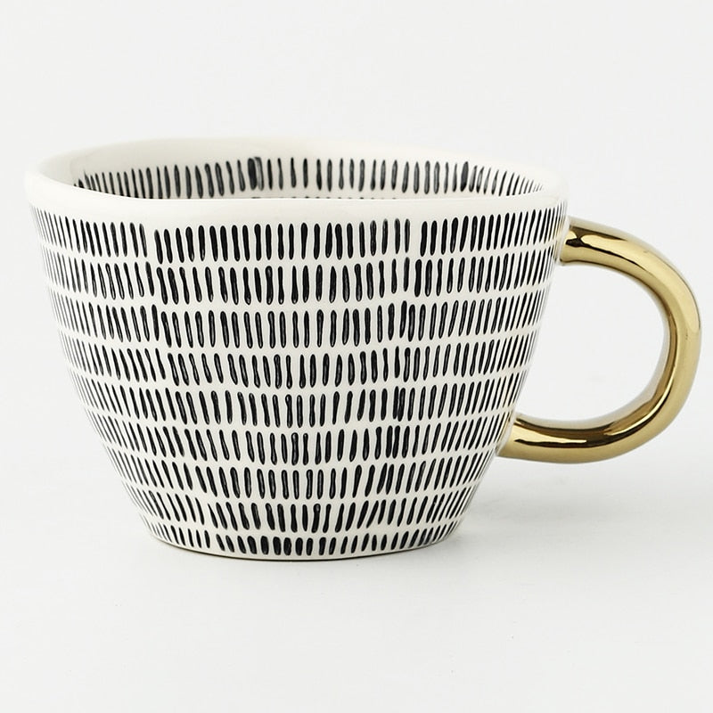 Norvo | Cup med abstrakt geometrisk mønster og gullhåndtak