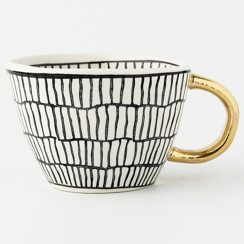 Norvo | Cup med abstrakt geometrisk mønster og gullhåndtak