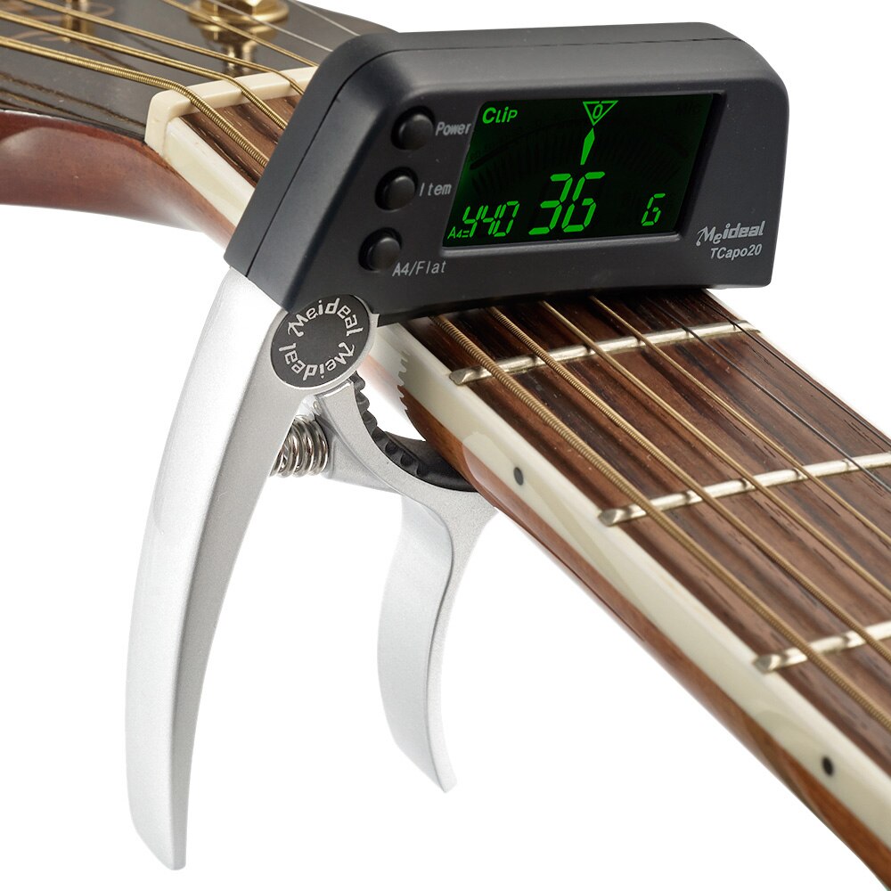 Norvo | Capo & Tuner "TuneGrip" – 2-i-1 gitar tilbehør med LCD-skjerm