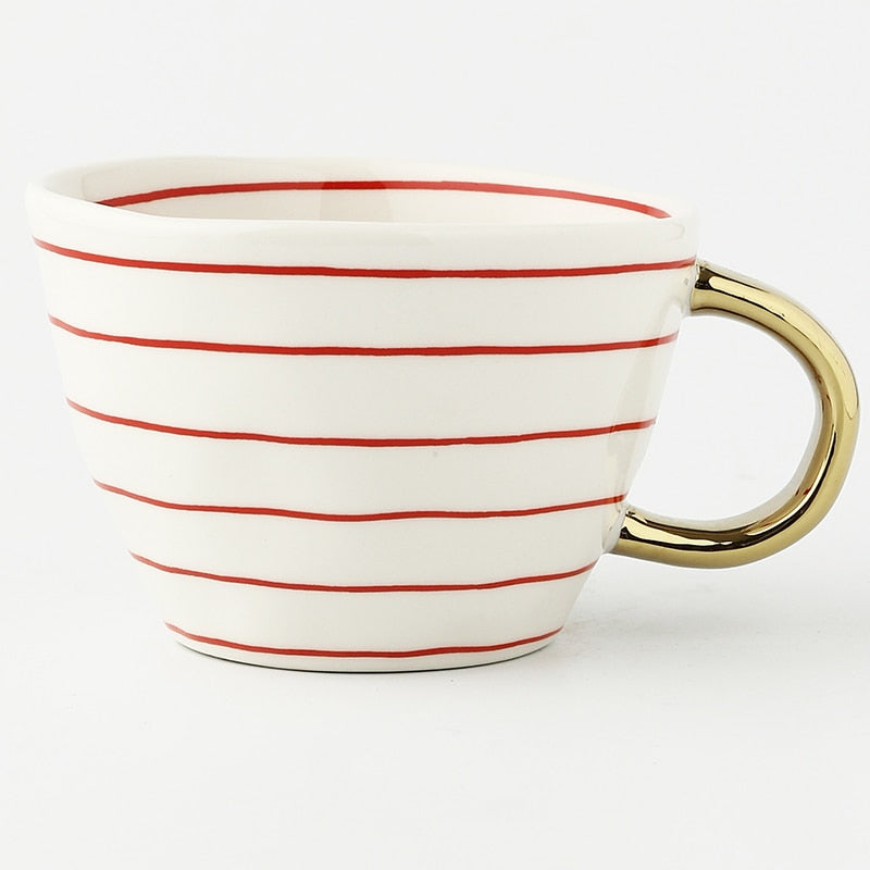 Norvo | Cup med abstrakt geometrisk mønster og gullhåndtak