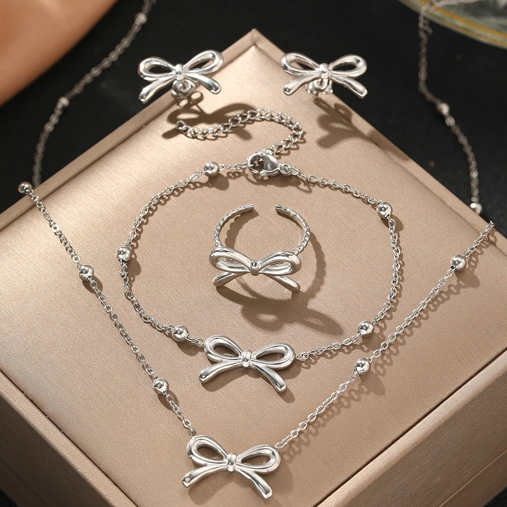 Norvo | Feminine Bow Satellite Chain Necklace, Bracelet, Earrings, and Ring Set