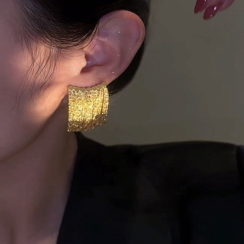 Norvo | Gylden Skinner By Frynse Øredobbe