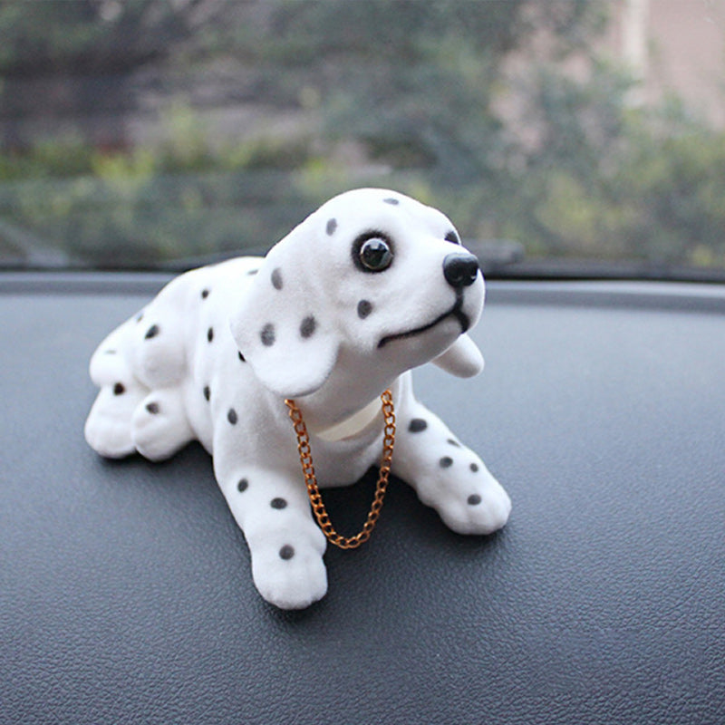 Norvo | Biltrailer med vaklende hode hund