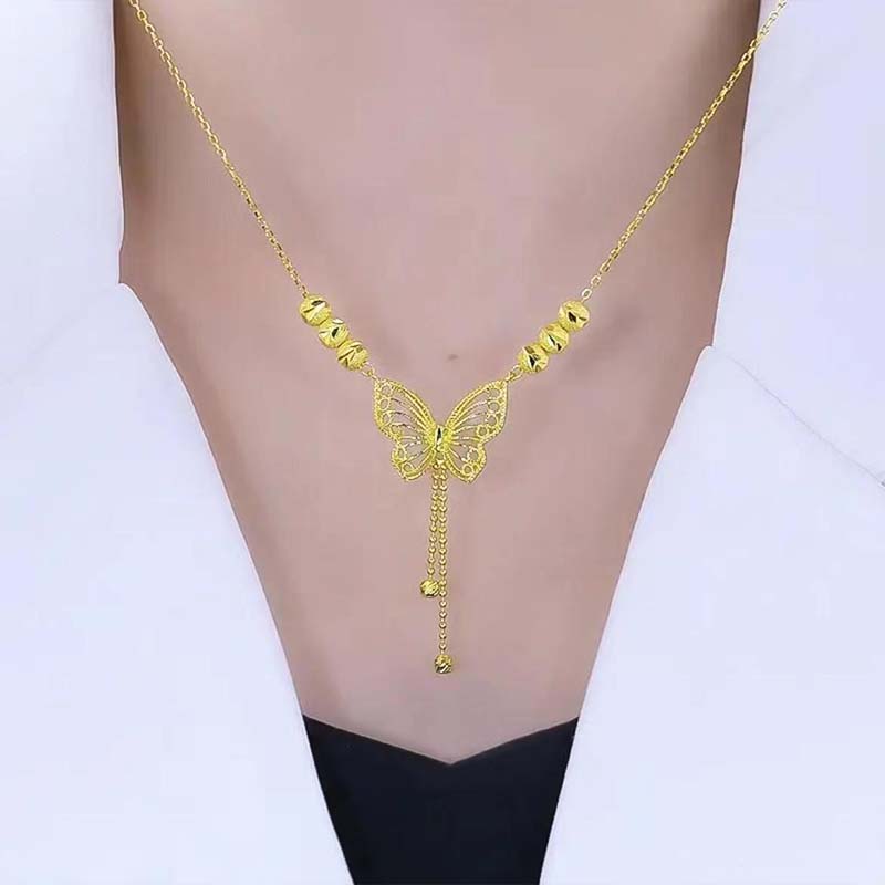 Norvo | Halskjede med gullfarget sommerfugl med dusker